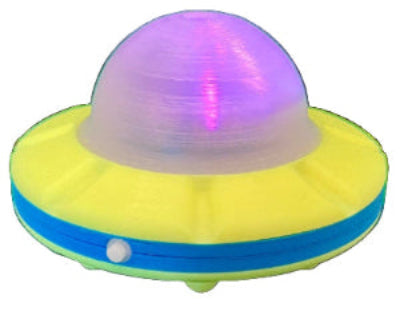 Toy UFO with a glowing purple top on a white background